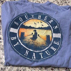 Blue long sleeve shirt with design on back. Size M